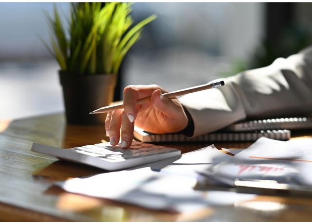 Businessman reviewing cost breakdown for company registration in Dubai.